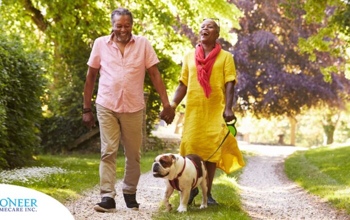 Walks, like this older couple and their dog are engaged in, are great activities for seniors in the springtime.